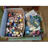 Two small boxes of vintage sewing items including cotton reels, threads, etc.