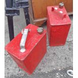 Two later painted Esso petrol cans