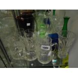 A selection of assorted glassware including cut and coloured vases, tankards, etc.