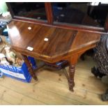 A 76cm Edwardian walnut octagonal centre table with gallery to undertier, set on turned supports and