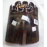 An old Polynesian tortoise shell hair comb with fret carved diorama to the top depicting animals and