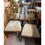 A set of four old mahogany framed Chippendale style ribbon back dining chairs, with upholstered