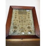 An oak framed Victorian needlework sampler named for Ann Dinnis Aged 10 1840 - faded condition