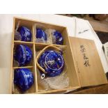 A Japanese Fukagawa blue and white porcelain tea ceremony set with teapot and five lidded bowls