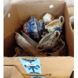 A box containing a quantity of blue and white and other pottery items