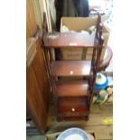 A 35cm reproduction mahogany freestanding four shelf open bookcase with decorative pierced sides and