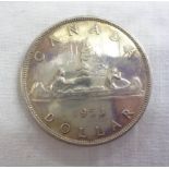 A 1953 Canada silver Dollar with canoe design