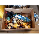 A box containing a collection of mainly ceramic bird ornaments and condiments, ceramic fruits, etc.
