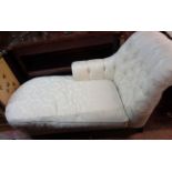 A 1.68m modern chaise longue upholstered in floral cut cream coloured tapestry, set on turned end