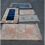 Five small modern washed wool mats, the largest (deep blue ground) - 1.35m X 70cm