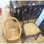 A child's wicker tub chair - sold with a stained wood bedroom chair