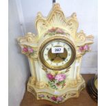 A late Victorian Fenton Foley Ware decorative porcelain cased mantel clock with printed floral