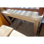 A 1.38m old stripped pine farmhouse kitchen table, set on heavy square supports