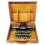 An early 20th Century oak cased home Blickensderfer (USA) typewriter - H.L.S. R.N. initials to lid