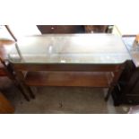 A 1.22m 20th Century mahogany two tier servery in the antique style with break bow front and