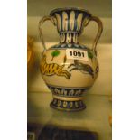 A Kashmiri pottery two handled vase decorated with a frieze of tigers and antelopes
