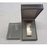 A vintage Swiss made Dunhill rollagas lighter in original case with silver plated hammered