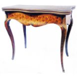 An 82cm 19th Century French marquetry fold-over card table with serpentine front, ormolu mounts