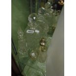 A pair of cut glass spirit decanters - sold with assorted condiment and scent bottles