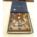 A modern House of Marbles Nine Mans Morris game with wooden board and glass marbles in original