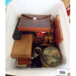 A crate containing assorted collectable items including tins, marbles, figurines, etc.
