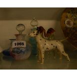 A small quantity of glass and pottery including a Beswick dalmation, Caithness scent bottles, etc.