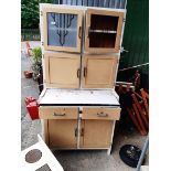 A 1930's kitchen larder cabinet with pull out enamel pastry shelf and decorative frosted glass panel