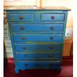 An old tall model chest of drawers with blue painted finish
