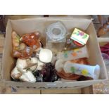 A box containing assorted ceramics and glass including carnival glass, golly mugs, teaware, etc.