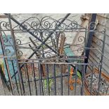 A pair of wrought iron driveway gates