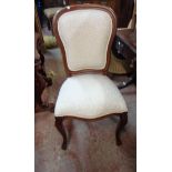 A modern reproduction mahogany framed panel back dining chair, set on cabriole front legs