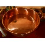 A 19th Century copper preserving pan with cast handles