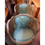 A pair of giltwood framed tub chairs with double skin bergere sides and upholstered backs and seats,