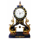 An early 19th Century Austrian ornate salon mantel clock with applied brass detail and flanking