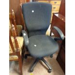 A modern swivel office elbow chair with adjustable action
