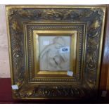 A modern marbleised resin plaque in elaborate gilt frame