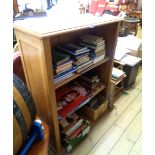 An 82cm waxed pine three shelf open bookcase, set on plinth base