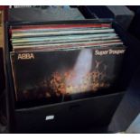 A case of LP records including John Lennon, ABBA, etc.