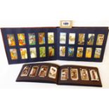 An album containing a collection of early 20th Century Chinese and other cigarette cards - sold with