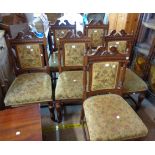 A set of six Edwardian oak framed drawing room standard chairs with upholstered backs and seats, set