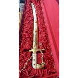 A boxed modern reproduction cavalry officer's sword with decorative scabbard