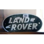 A modern cast metal Land Rover sign