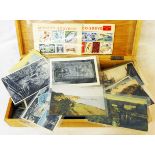 A wooden box containing a small collection of plastic sleeved 20th Century topographic and other