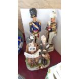 Two continental military figures - sold with a copy of a Capodimonte figure group