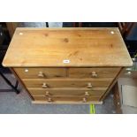 A modern pine chest of two short and three long drawers - wear