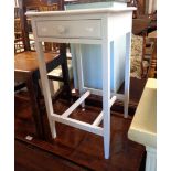 A 40cm painted wood side table with frieze drawer, set on slender square tapered legs