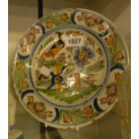 An 18th Century Bristol Delftware plate, depicting a bird sitting on a fence - old restoration