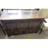 A 1.25m late 19th Century oak mule chest with triple panelled front and applied metal decoration,