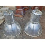 A pair of large aluminium industrial hanging lamps