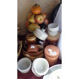 A selection of ceramics, including Brannam storage jars, ramekins, Italian fruit sculpture,